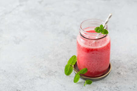 Watermelon smoothies in glass jarsの写真素材
