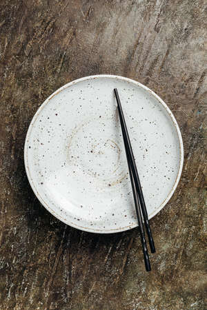 Empty plate with chopsticks.の写真素材