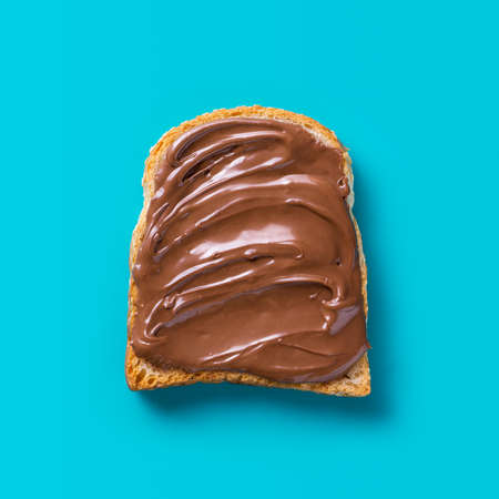 Toast with Chocolate on a blue background. Flat layの写真素材