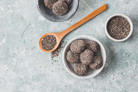 Healthy energy balls made from dried fruits, dates, nuts, covered with Chia seeds. Top view.の写真素材