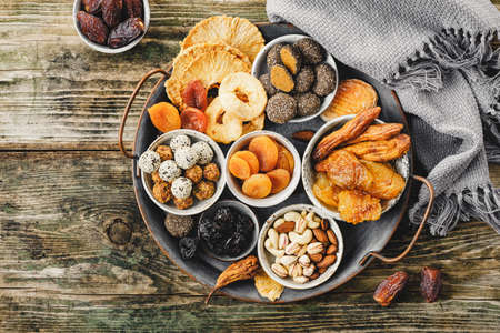 Homemade sweets from dried fruits without sugar and different nuts. Top view.の写真素材
