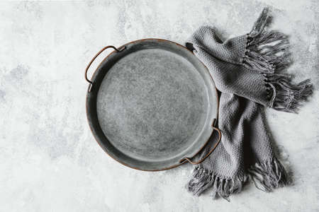 Empty metal tray on a greyの写真素材