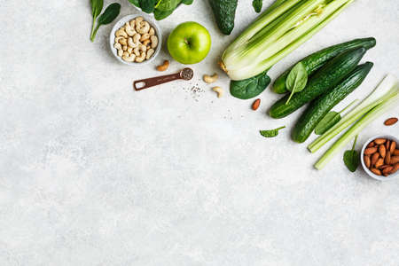 Ingredients for green smoothies, celery, apple avocado, and spinach. Copy space. Top viewの写真素材