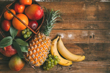Exotic fruit on a wooden background with copy space.の写真素材