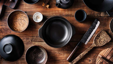 Set of dishes for Asian cuisine, pot, bowls, wok, Japanese knifeの写真素材