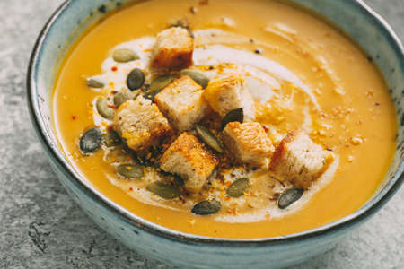 Bowl of delicious autumn pumpkin soupの写真素材
