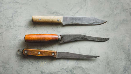 Old knifes on a greyの写真素材
