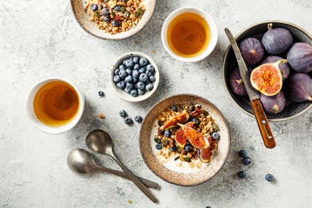 Delicious and healthy Breakfast with homemade granola, fruits and berries.の写真素材
