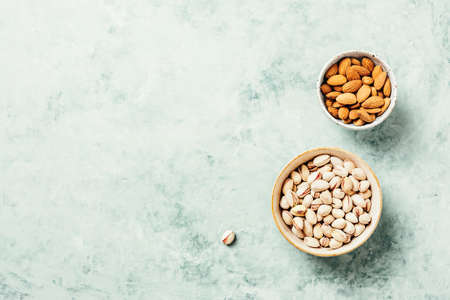 Varieties of nuts cashew, pistachio, almond. Health concept. Food background with copy space top viewの写真素材