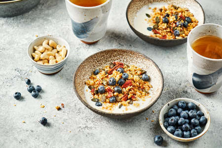 Homemade granola with yogurt and blueberry. Healthy Breakfast. Selective focus.の写真素材