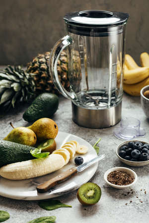 Process of making fruit smoothies, fruits and berries, food background.の写真素材