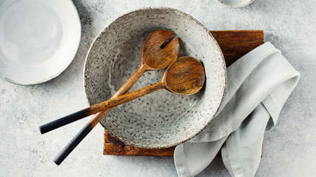 Salad bowl with wooden salad spoon and fork. Top view.の写真素材