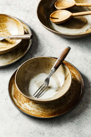 Salad bowls, plates and forks.