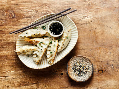 Fried dumplings with herbs and sesameの写真素材
