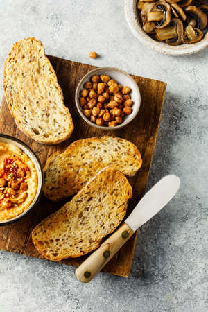 Toasted slices of bread on a wooden cutting board.の写真素材