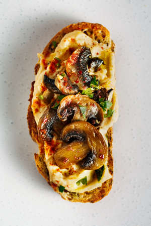 Tasty toast with and mushrooms and herbs. Close up.