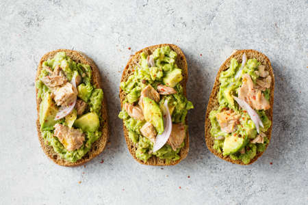 Healthy toast with avocado and tuna. Top view.の写真素材