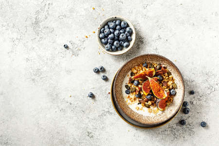 Granola with yogurt and fresh figs. Healthy breakfast.の写真素材