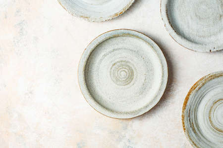 Ceramic plates on a light backgroundの写真素材
