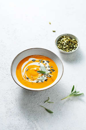 Spicy vegetable soup with pumpkin seed and fresh herbs.
