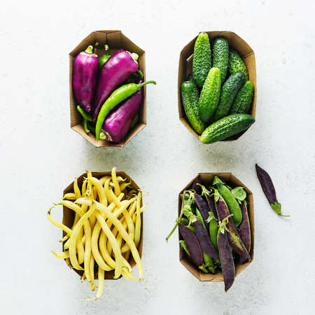 Green and purple organic vegetables, cucumbers, beans, peas, bell peppers.の写真素材