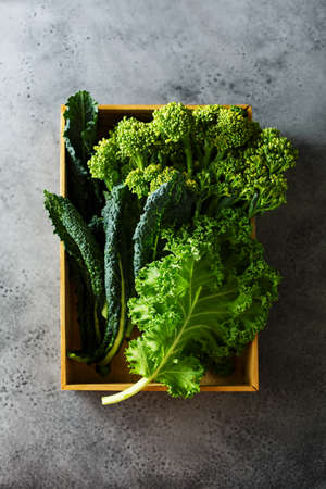 Green leafy cabbage in a wooden boxの写真素材