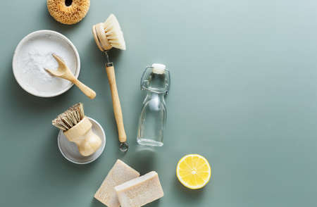Natural cleaning products, baking soda, wooden brushes, vinegar, lemon, salt, soap.の写真素材