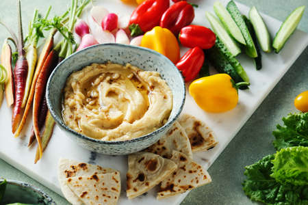 Mediterranean dip and different vegetables.の写真素材
