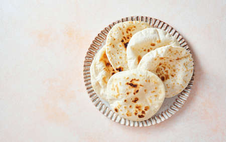 Pita bread on a plate, top viewの写真素材
