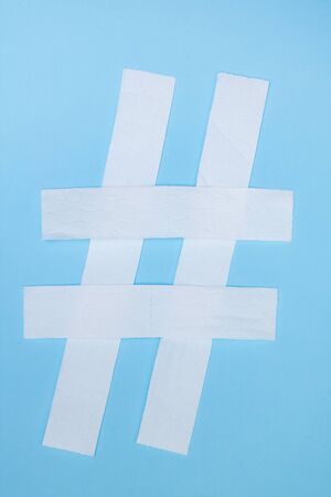 Toilet paper hashtag sign on a blue backgroundの写真素材
