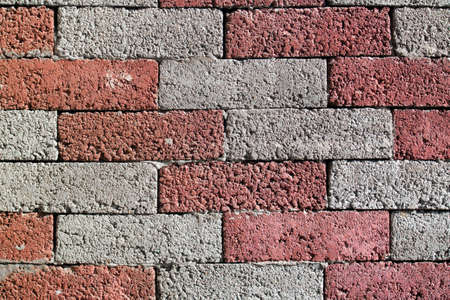 The street wall of red and gray bricks diagonal.の写真素材