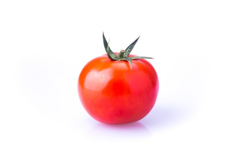 red, delicious, fresh tomato on white backgroundの写真素材