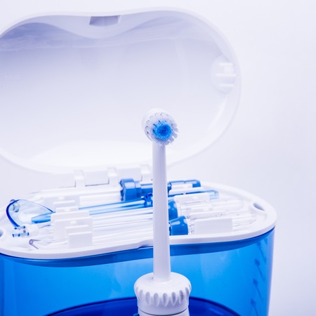 universal oral irrigator the oral cavity, designed to flush out food debris and soft dental plaque from interdental spaces. Is also used for tongue cleaning, braces, periodontal pockets and gum massage.の写真素材