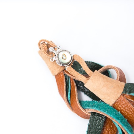 the decoration of leather. handmade on a white backgroundの写真素材