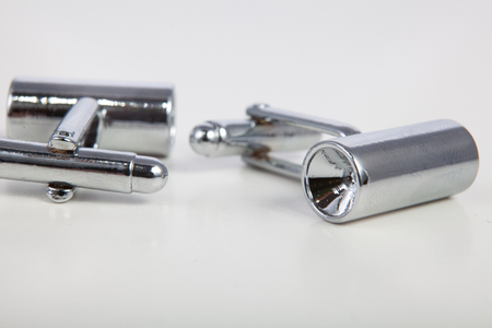 men's cufflinks on a white isolated backgroundの写真素材