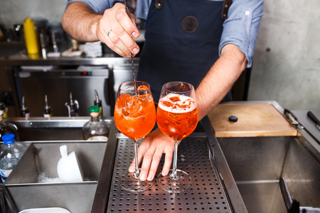 Barman at work, preparing cocktails. concept about service and beverages In the kitchen in the restaurantの写真素材