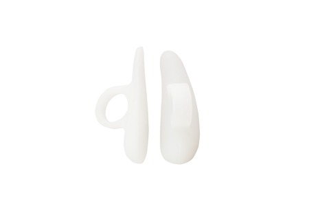 The orthopedic device is intended for the removal of the first finger. The product for the implementation of treatment-and-prophylactic correction with the effect of crisscross fingers. The interdigital insert is made of gel, easy and convenient to use.の写真素材