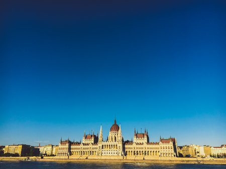 Evening sun on the facade of the Parliament building across Danube river, Budapest, Hungary.の写真素材