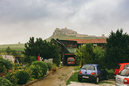 Spisske Podhradie town and Spis Castle Spissky hrad , Presov Region, Slovakia June 17, 2016 View from the hotel to the castle in cloudy summer weather.のeditorial素材