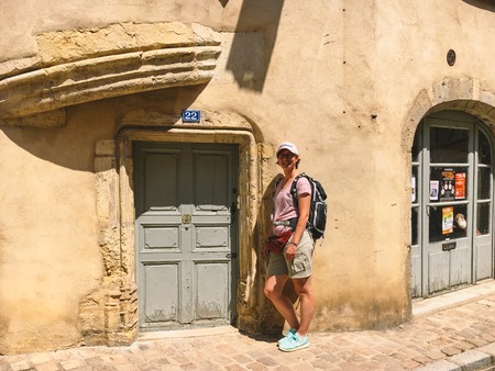 July 18, 2017 France city of Cluny, the region of the Burgundy: People tourists are walking along the old narrow street of the central part of the city in hot, sunny summer weather.のeditorial素材