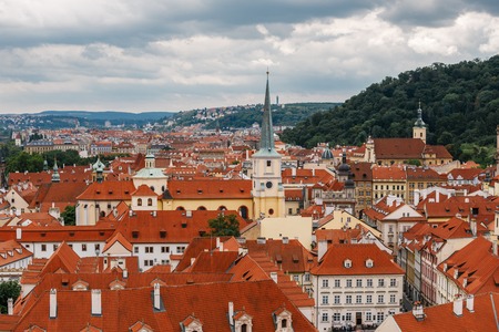 Czech Republic, Prague, July 25, 2017: Panoramic view of the city. Red Roofs of houses and structures of the old city in the summer in cloudy cloudy weather.の写真素材