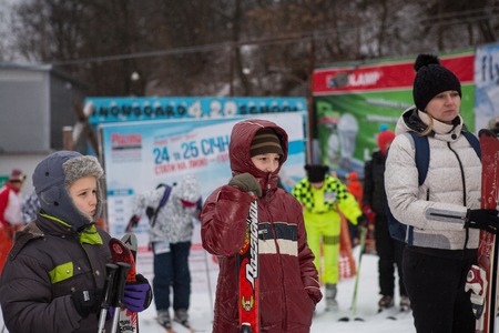 Ukraine, Kiev ski resort Protasov Yar January 25, 2015. The ski slope in the city center. Ski school for children. The instructor teaches a group of people in the winter to snow a mountain to ski.のeditorial素材