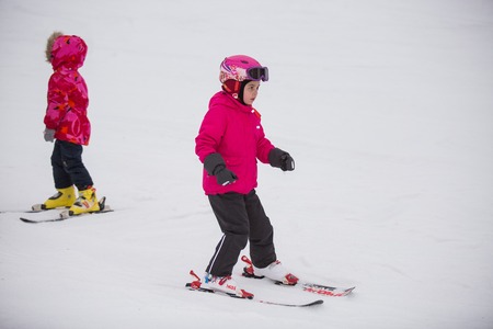 Ukraine, Kiev ski resort Protasov Yar January 25, 2015. The ski slope in the city center. Ski school for children. The instructor teaches a group of people in the winter to snow a mountain to ski.のeditorial素材