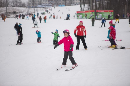 Ukraine, Kiev ski resort Protasov Yar January 25, 2015. The ski slope in the city center. Ski school for children. The instructor teaches a group of people in the winter to snow a mountain to ski.のeditorial素材