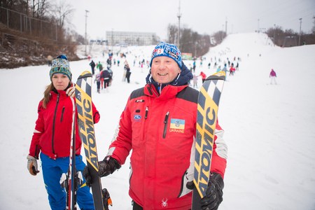 Ukraine, Kiev ski resort Protasov Yar January 25, 2015. The ski slope. Ski school Caucasian portrait man. Instructor. Trainer trains a group of people in the winter on a snow mountain to ski.のeditorial素材