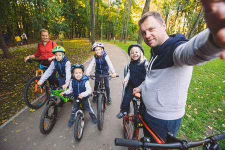 The theme family sports outdoor recreation. large family Caucasian 6 people mom dad and 4 children...