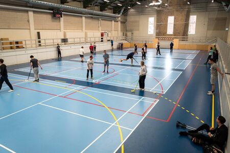February 21, 2019. Denmark. Copenhagen. Team game with stick and ball Floorball or hockey in hall....