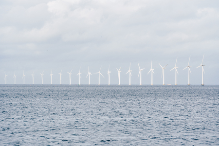 The theme is net power generation and environmental protection. A number of wind blades, wind power...