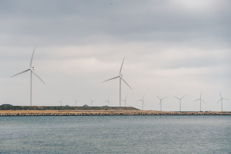 The theme is net power generation and environmental protection. A number of wind blades, wind power in the Baltic Sea in Europe Denmark Copenhagen in winter.の写真素材