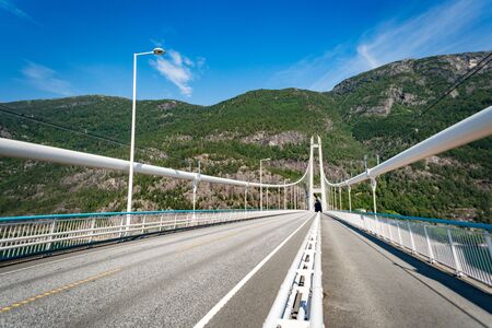 Hardanger Bridge. Hardangerbrua connecting two sides of Hardangerfjorden. Norway Hardangerfjord Hardanger bridge. newly built Hardangerbrua bridge close to Ulvik in Western Norway.の写真素材